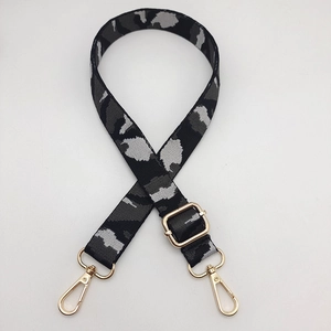 Adjustable camouflage bag strap with golden metal swivel hooks for crossbody bags