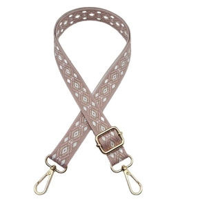 Bohemian geometric patterned crossbody bag strap with gold metal hooks and pink weave