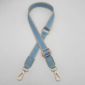 Sky blue and beige woven bag strap with Greek key pattern and gold metal lobster clasps