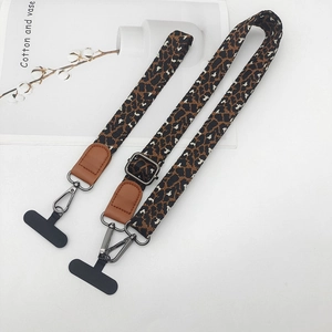 Leopard print neck phone lanyard with brown leather attachment and gray metal hooks