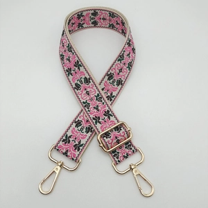 Adjustable jacquard bag strap with pink floral pattern and gold metal hooks