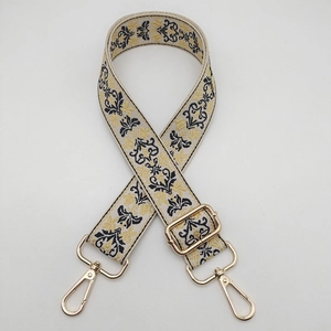 Close-up of vintage jacquard strap with gold hardware and European floral pattern