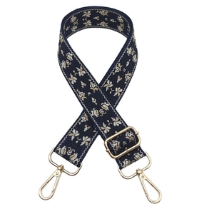 Adjustable navy jacquard strap with gold floral patterns and metallic swivel hooks