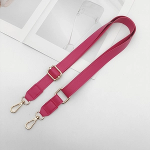 Detail showing rose red PU leather strap with golden metal swivel lobster clasps