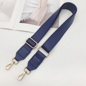 Detail of adjustable dark blue PU leather bag strap with high-quality gold metal lobster hooks
