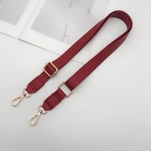 Detail view of dark red PU leather replacement strap with adjustable gold buckle and hooks