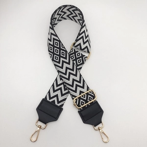 Adjustable 5cm wide woven shoulder strap in black and white pattern with gold hooks