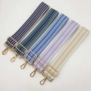 Detail of adjustable 5cm wide colorful ethnic style straps with gold metal hardware
