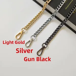 Close-up of metal bag chain straps in light gold, silver, and gun black finishes
