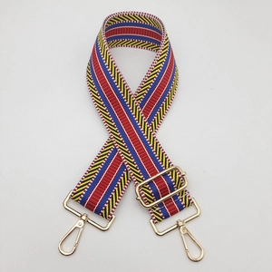 Macro shot of 5cm ethnic striped woven bag strap with adjustable gold lobster buckles
