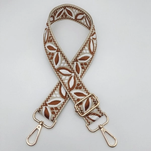 Adjustable wide guitar style bag strap with floral embroidery and golden metal hooks