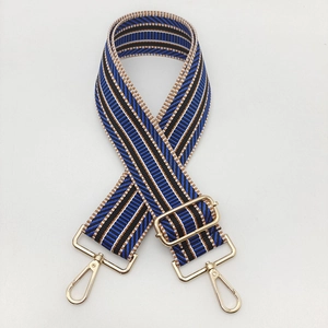 Detail of 5cm ethnic style striped wide bag strap with golden metal buckle and lobster clasp