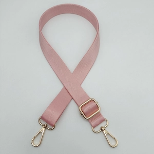 Pink adjustable nylon shoulder strap with herringbone pattern and gold metal swivel hooks