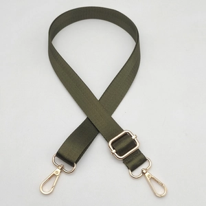 Close-up of army green nylon bag strap with gold metal lobster hooks and herringbone weave
