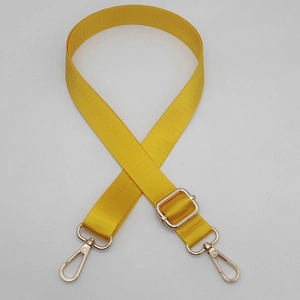 Adjustable bright yellow nylon shoulder strap with gold metal lobster clasps for bags