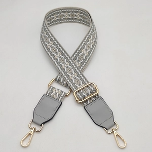 Adjustable geometric woven wide strap for bags with grey leather accents and gold hardware