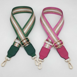Detail of adjustable wide shoulder straps with colorful stripes and gold metallic thread