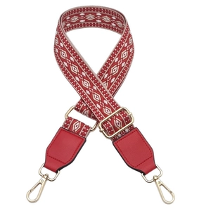 Adjustable geometric woven bag strap with red leather ends and gold metal clips