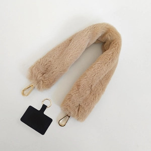 Detail of khaki faux fur phone lanyard with gold metal hooks and black spacer pad
