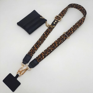 Detailed view of leopard print crossbody phone strap with matching leather coin purse