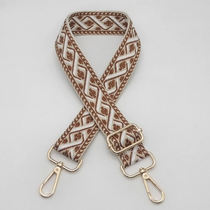 Adjustable wide jacquard bag strap with ethnic geometric pattern and gold hardware