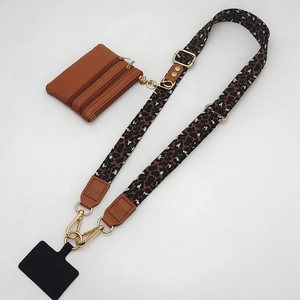 Detail view of leopard print strap and brown PU leather coin purse with gold zippers