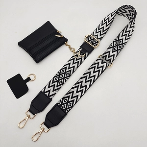 Detail of adjustable geometric strap with a black mini zipper pouch and gold hardware
