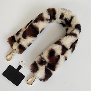 Detailed view of leopard print plush phone lanyard with gold metal lobster clasps