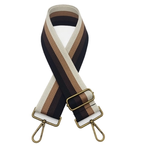 Ethnic striped wide bag strap with bronze swivel hooks and adjustable buckle on white background