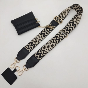 Adjustable black and white patterned phone strap with a triple-zipper leather pouch and gold clips