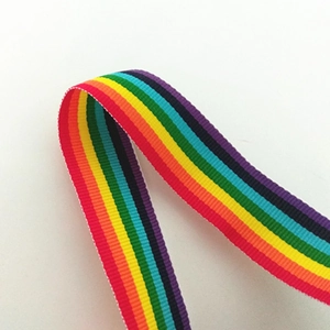 Close-up of durable rainbow striped ribbon strap with premium woven texture for bags