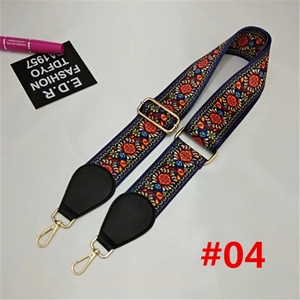 Close-up of bohemian jacquard strap with gold hardware and black leather connectors
