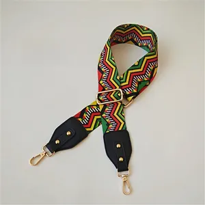 Ethnic style woven shoulder strap with geometric patterns and gold metal swivel hooks