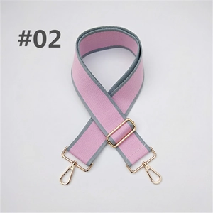 Detail of adjustable wide shoulder strap in pink and grey fabric with gold metal clips