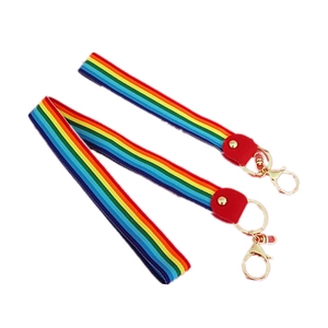 Rainbow striped lanyards set with gold lobster clasps and red faux leather accents