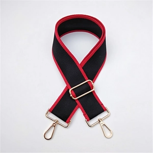 Adjustable wide replacement bag strap in black canvas with red piping and gold metal hooks
