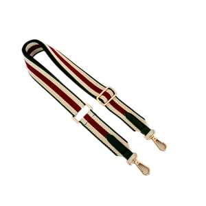 Adjustable wide canvas shoulder strap with red and green ethnic stripes and gold metal hooks