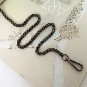 Detail of gunmetal braided chain strap with lobster clasp for crossbody handbags
