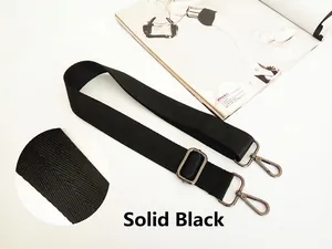 Detail of solid black adjustable woven strap with dark silver metal rotating buckles