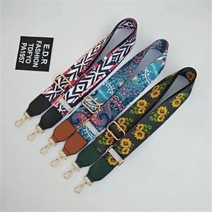 Three adjustable wide canvas bag straps with ethnic patterns and gold metal buckles