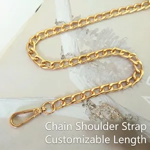 Detail shot of golden metal flat chain strap with polished lobster clasp for handbags