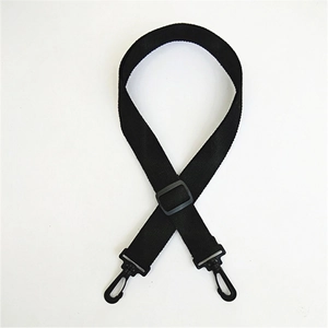 Detail of adjustable black cotton bag strap with dual swivel hooks and plastic buckle