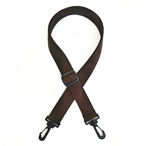 Detail of adjustable dark brown cotton bag strap with black plastic swivel hooks