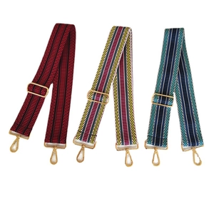 Three colorful patterned wide canvas shoulder straps with gold metal hardware adjusters