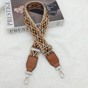 Ethnic style geometric jacquard bag strap with brown leather ends and silver metal clips