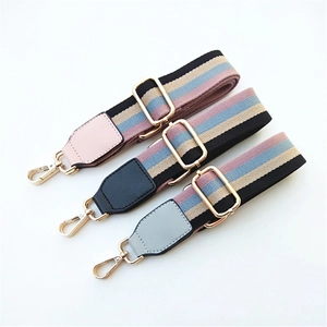 Adjustable striped canvas straps with premium leather ends and gold metal hooks