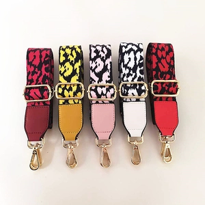 Detail showing five leopard print crossbody straps with gold hardware and faux leather ends