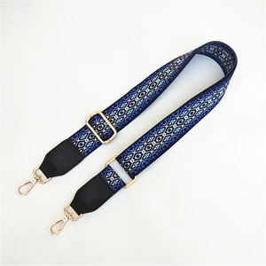 Detail of colorful ethnic geometric embroidery strap with gold-plated lobster clasps