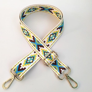 Close-up of bohemian geometric wide bag strap with durable gold metal swivel hooks