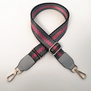 Adjustable wide nylon shoulder strap with red, white and black diagonal stripes and gold clips